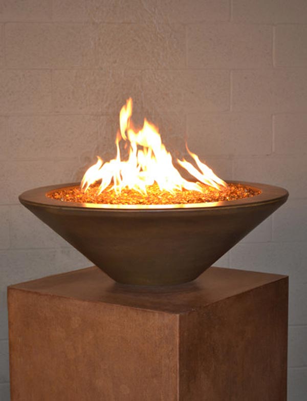 Round concrete fire pit table with open flames, dark gray finish