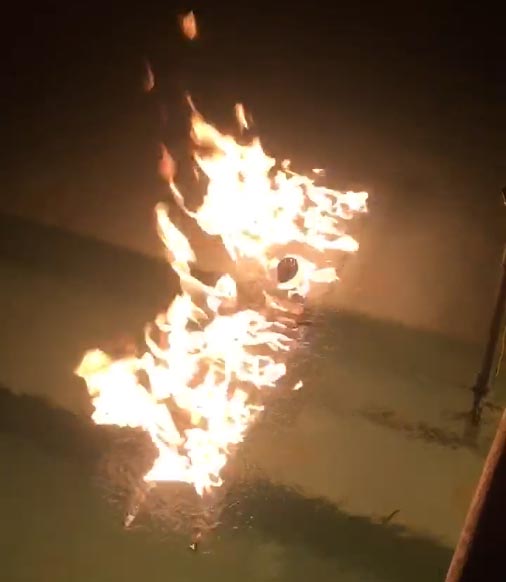 Submersible gas fire manifold in operation with bright flame jet
