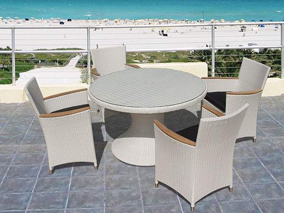 Light woven wicker armchair with light cushion and curved wooden armrests
