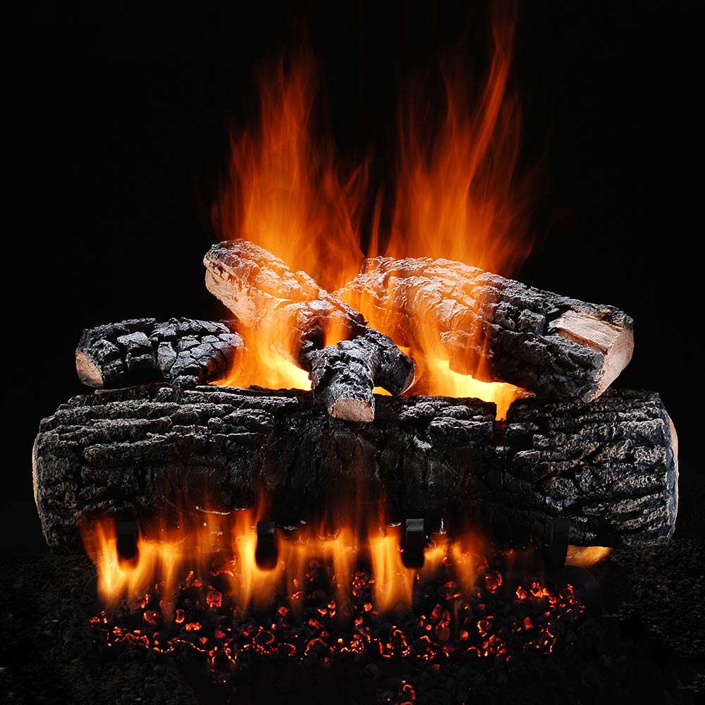 Vented gas log set with glowing flames and ember bed