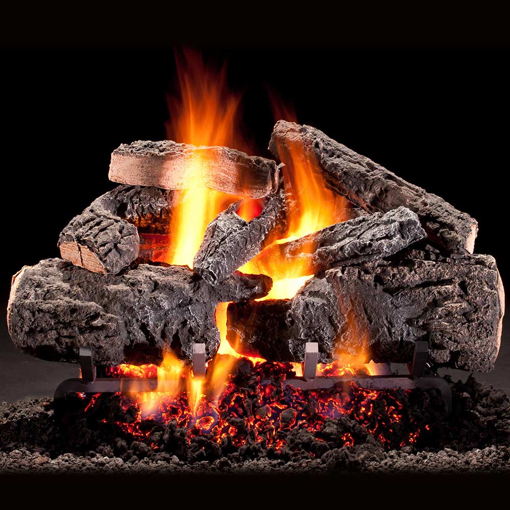 Vented gas log set with realistic charred logs and visible flames