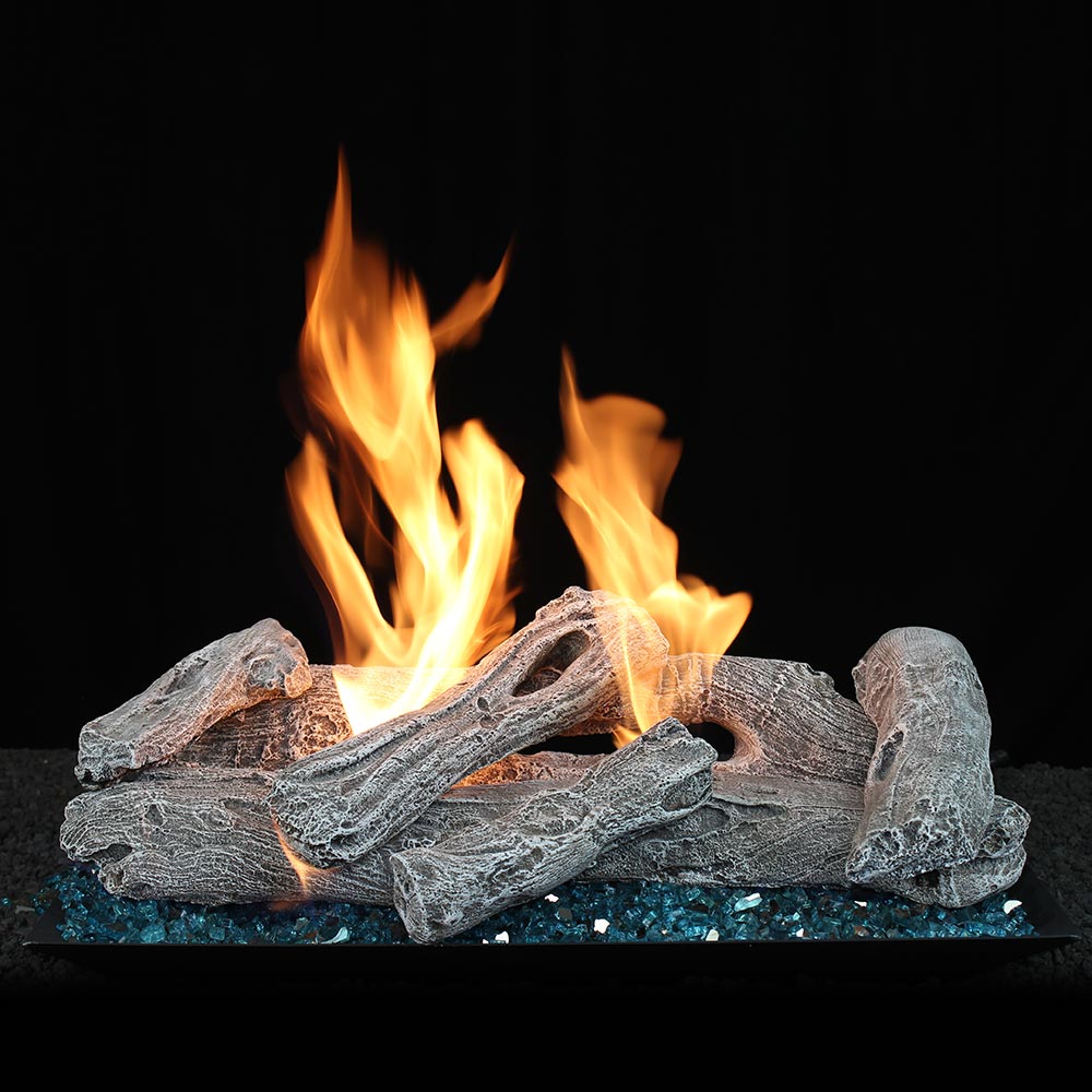 Vented gas log set with burning driftwood logs and ember base