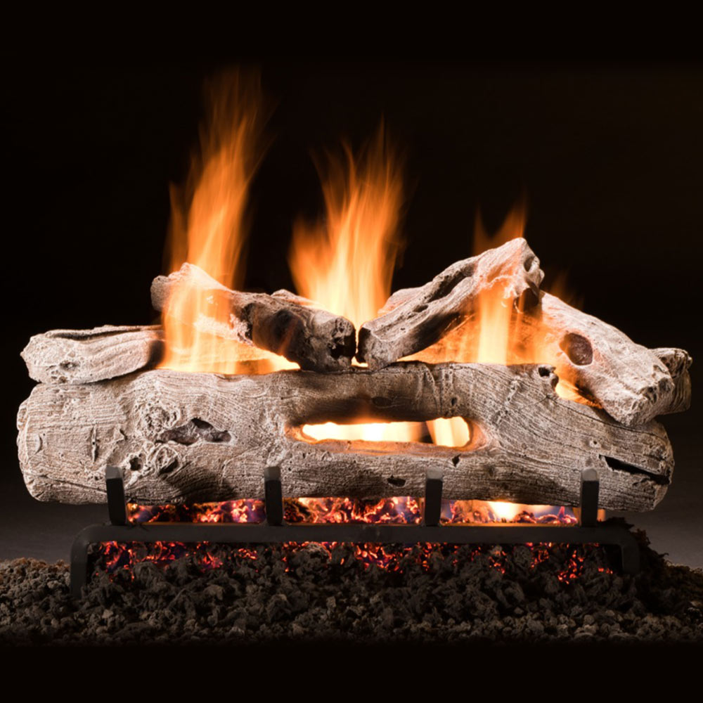 Hargrove driftwood vented gas logs with glowing flames and charred log texture