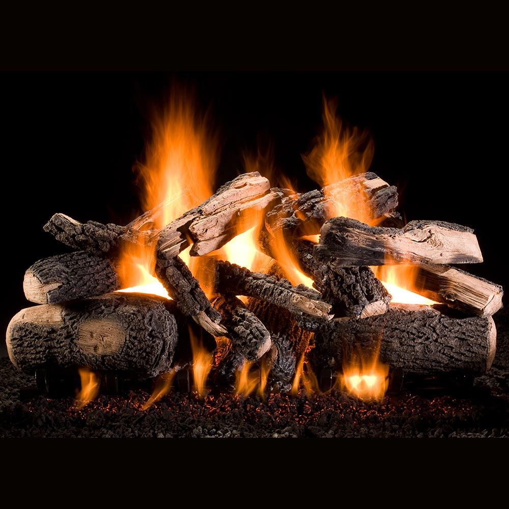 Vented gas fireplace log set with stacked charred logs and visible flames