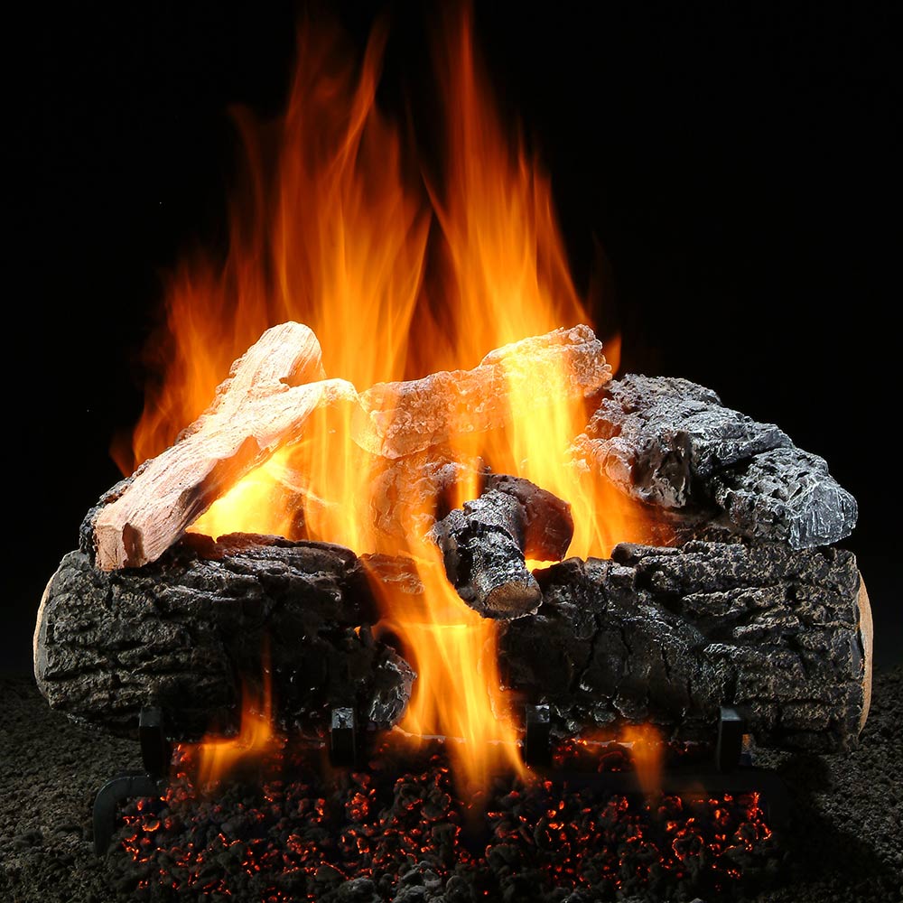 Vented gas log set with burning blackened logs and bright orange flames