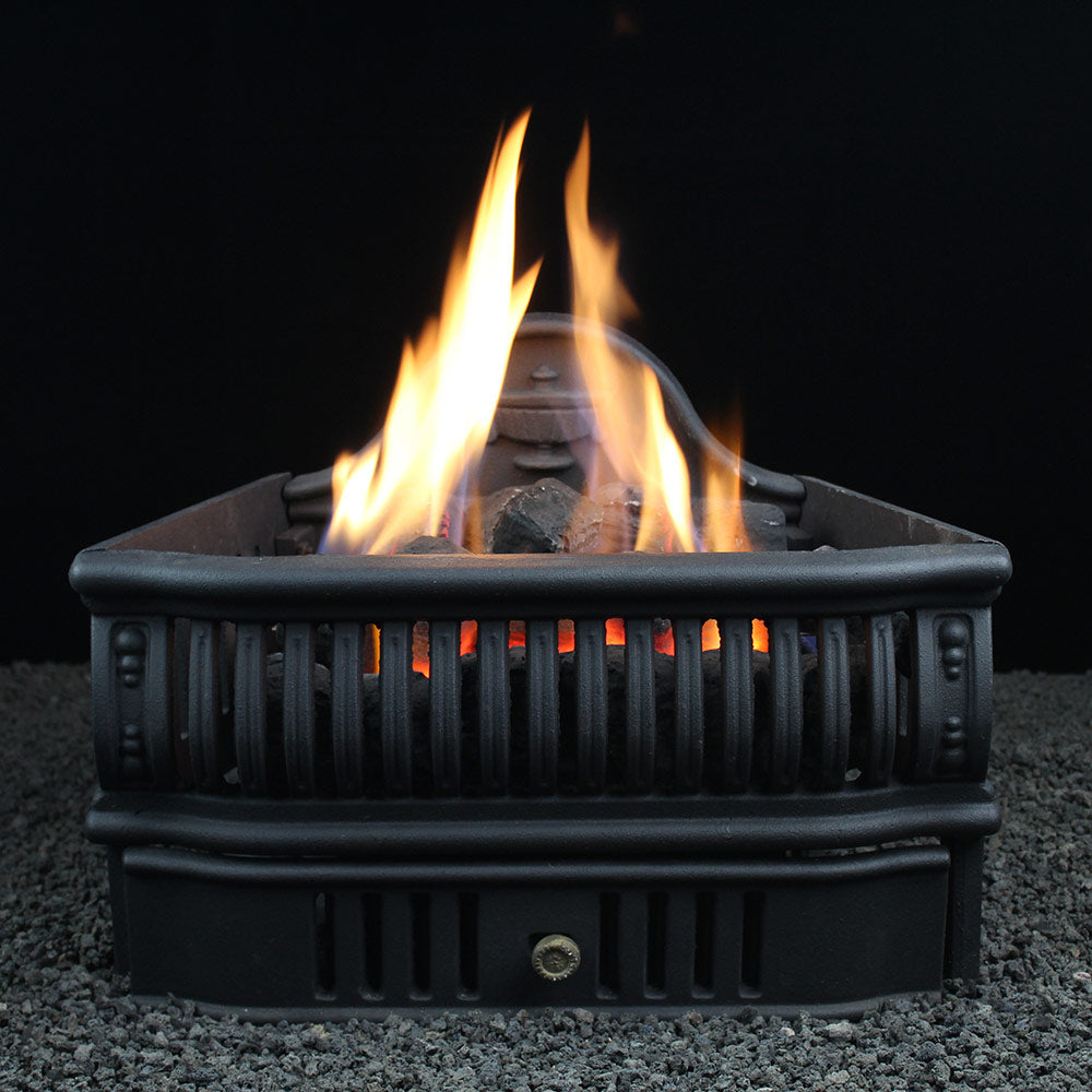 Vent-free gas log set in black metal basket with glowing burning logs and flames