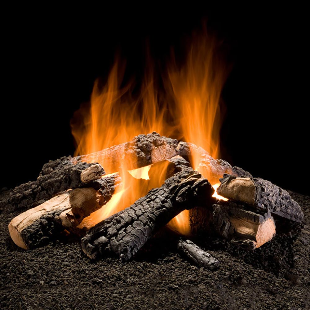 Outdoor gas fire pit log burner with burning fire ring and faux logs