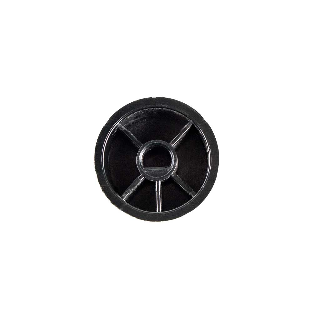 Black pilot control knob face with circular center and radial slots