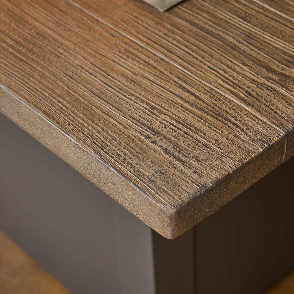 Wood-look tabletop edge and grain detail on a linear gas fire table