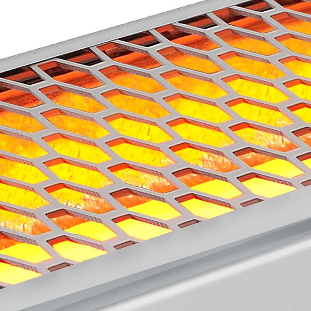 Close-up of patio heater radiant panel with orange and yellow glowing heating elements