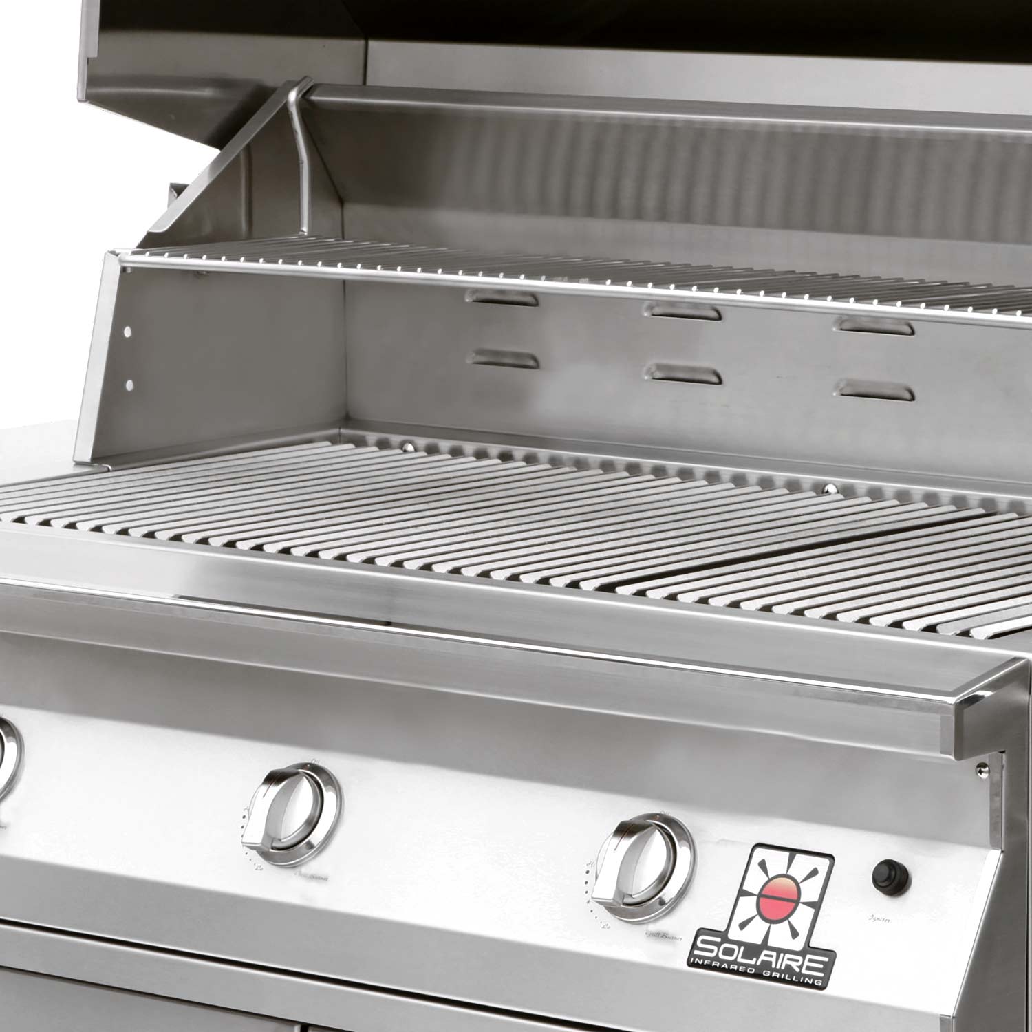 Stainless steel grill interior with striped burner grates and open hood