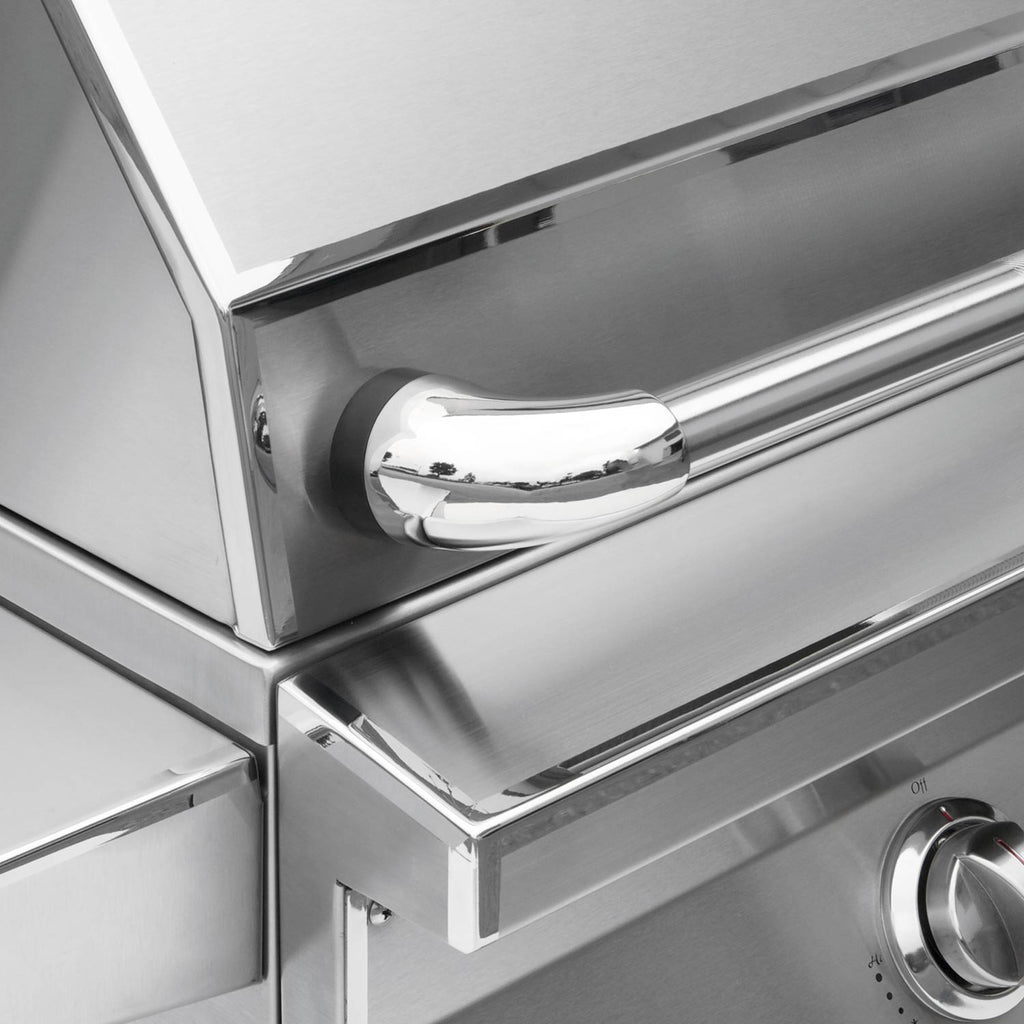 Stainless grill control panel with large knob and front handle area.