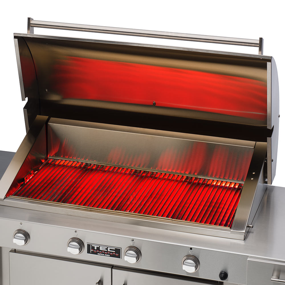 Open infrared gas grill with glowing red radiant bars inside stainless firebox