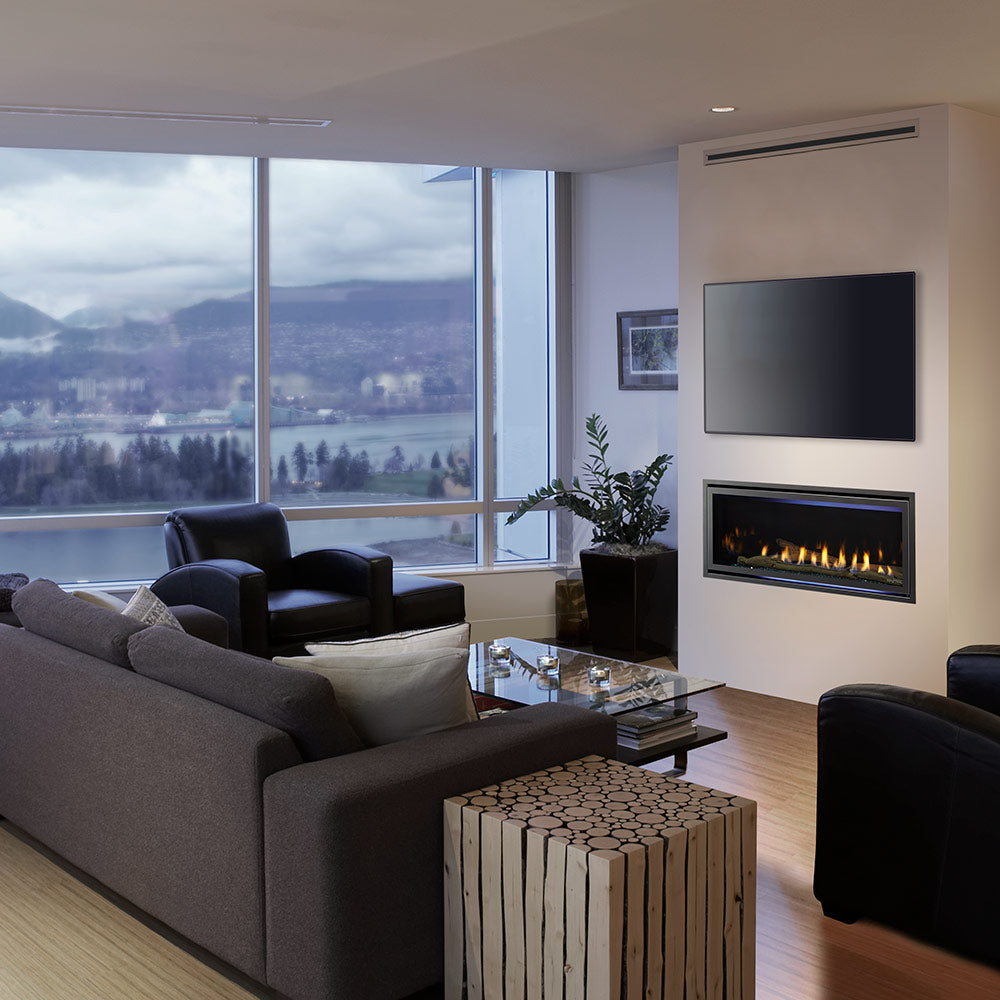 Direct vent gas fireplace installed in a modern living room with flames behind glass