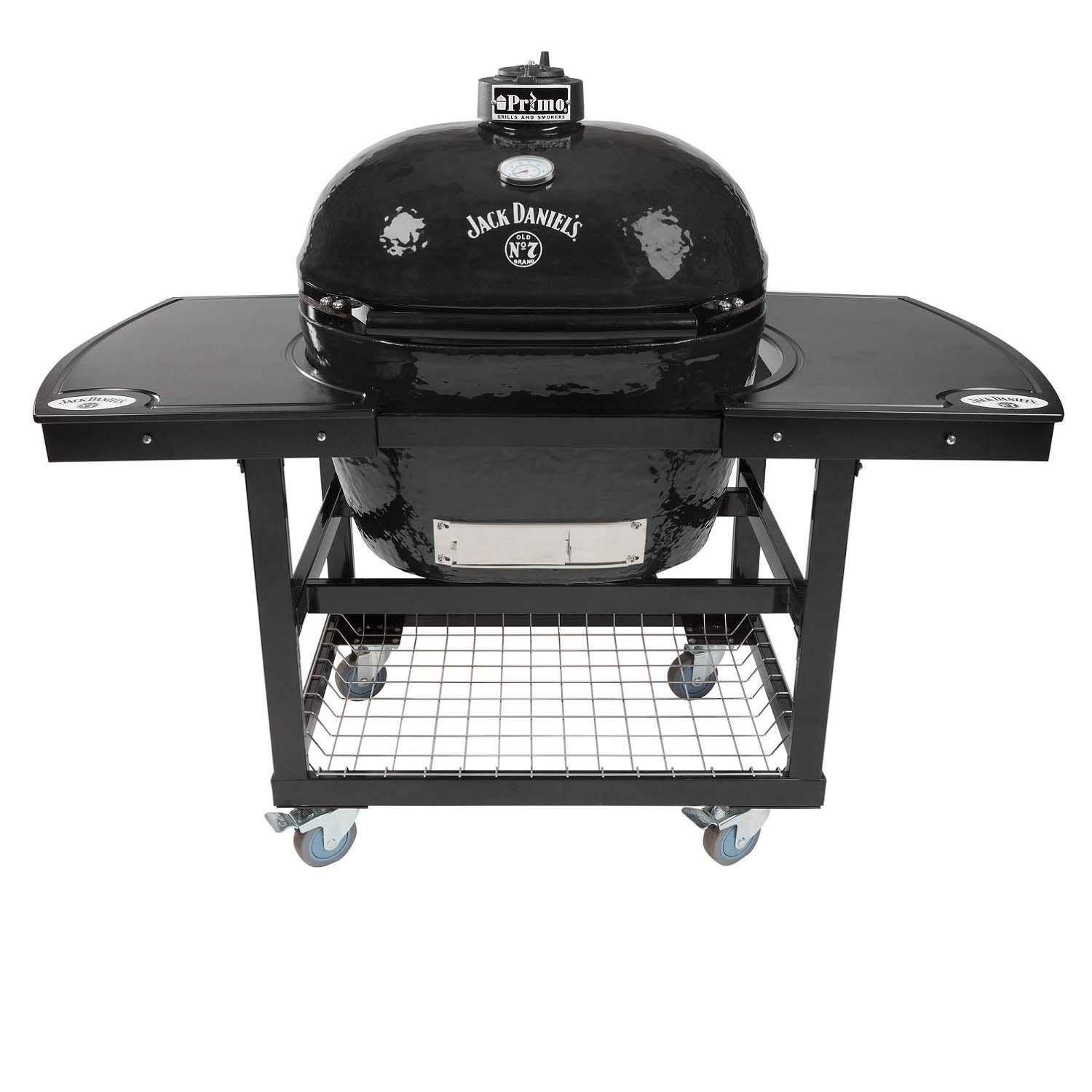 Oval ceramic charcoal kamado grill on wheeled cart with lower cooking grate