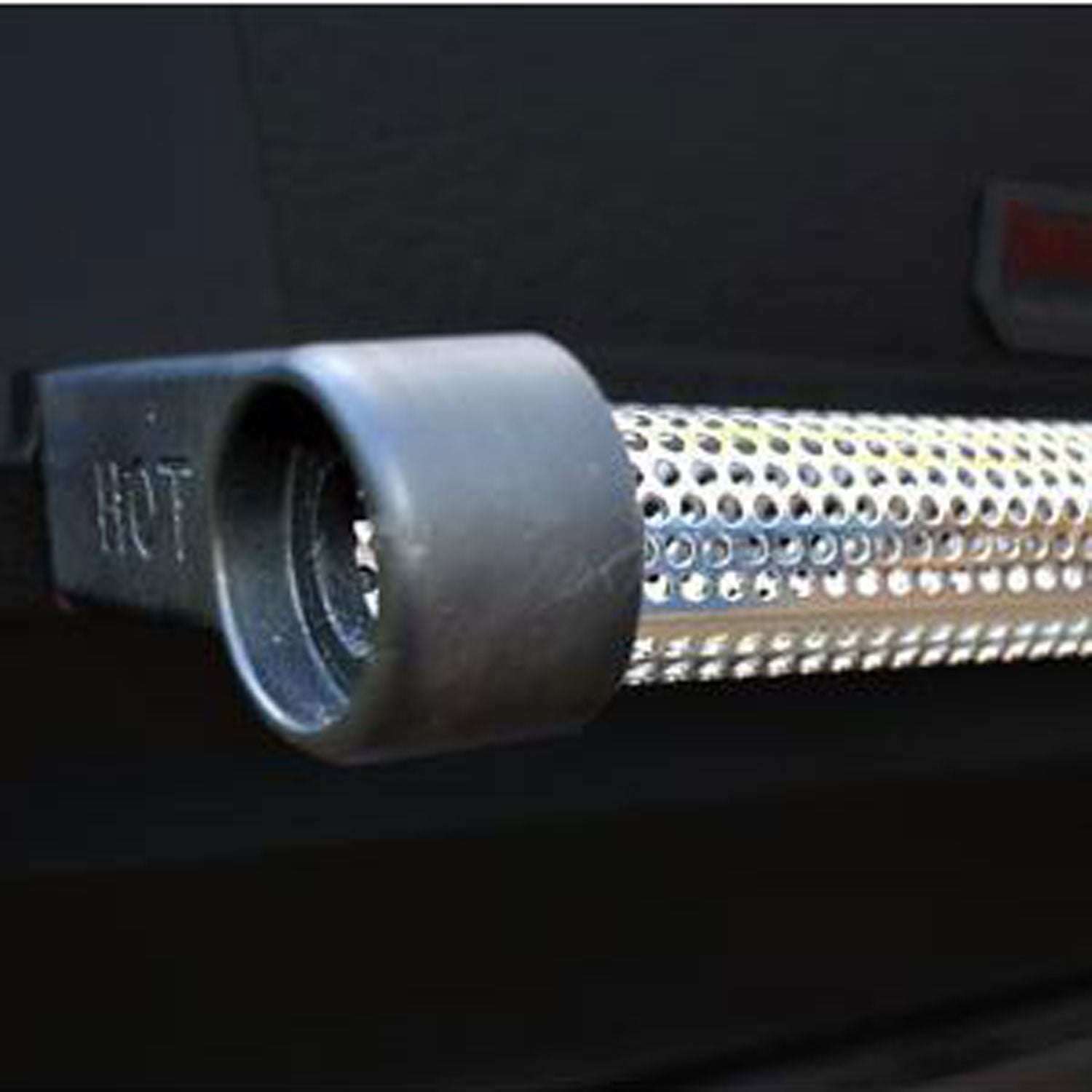 Perforated infrared heat emitter tube with metal housing inside an all-infrared gas grill