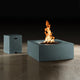 Seafoam square outdoor fire table with burning flame and side access cabinet