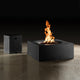 Gray square outdoor fire table with open flame and side access cabinet, front view