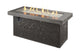 Outdoor gas fire pit with dark speckled rectangular body and flames in black firebox