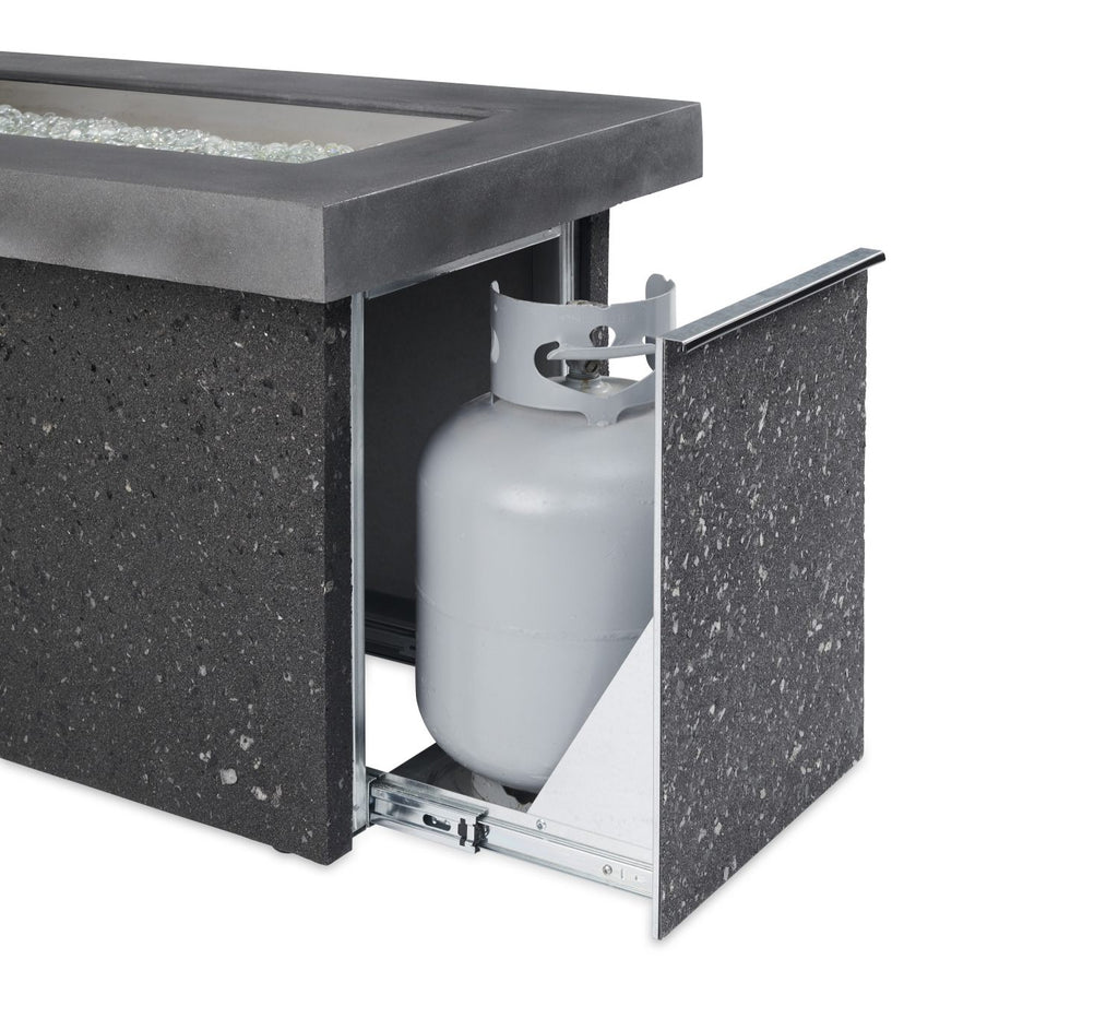 Outdoor fire pit with side access open, showing gas cylinder and regulator inside