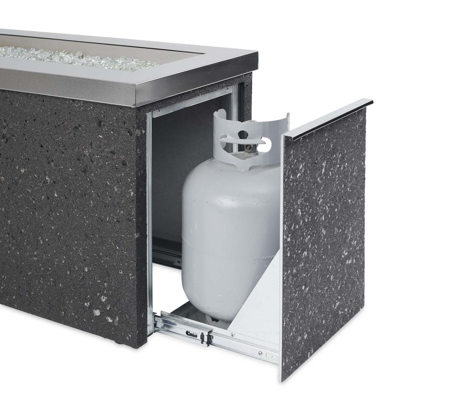 Outdoor gas fire pit with door open showing a white propane tank and regulator