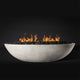 White oval fire pit with flames and lava rocks