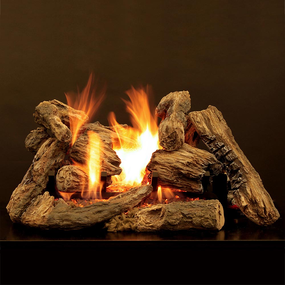 Radiant vented gas burner emitting flames with burning logs