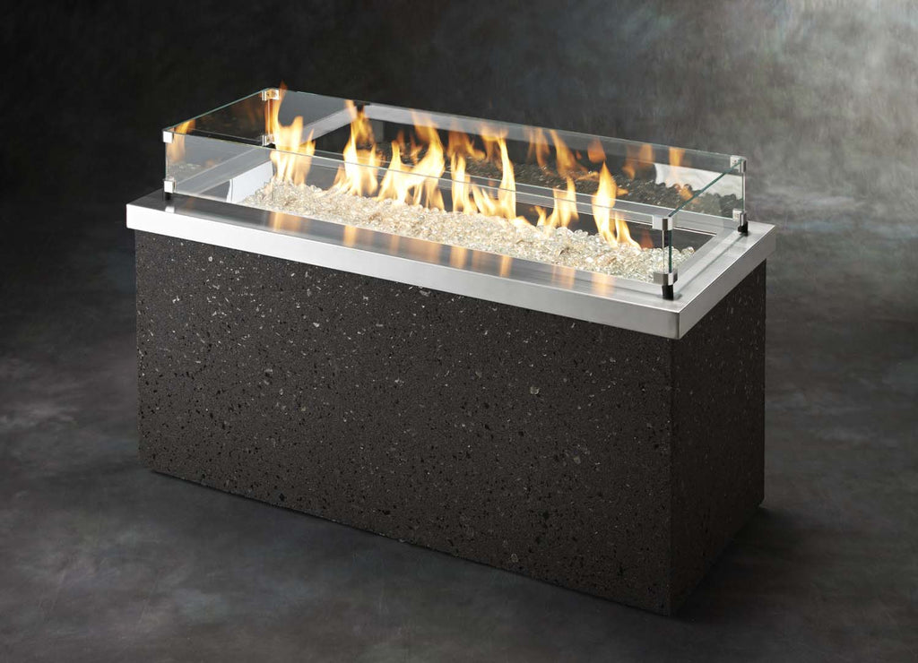 Outdoor gas fire pit with stainless top and black speckled sides, flames in burner pan