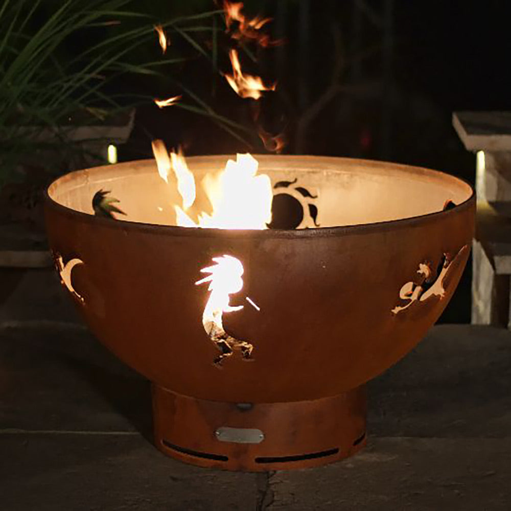 Brown gas fire pit with Kokopelli and animal cutouts, flames burning