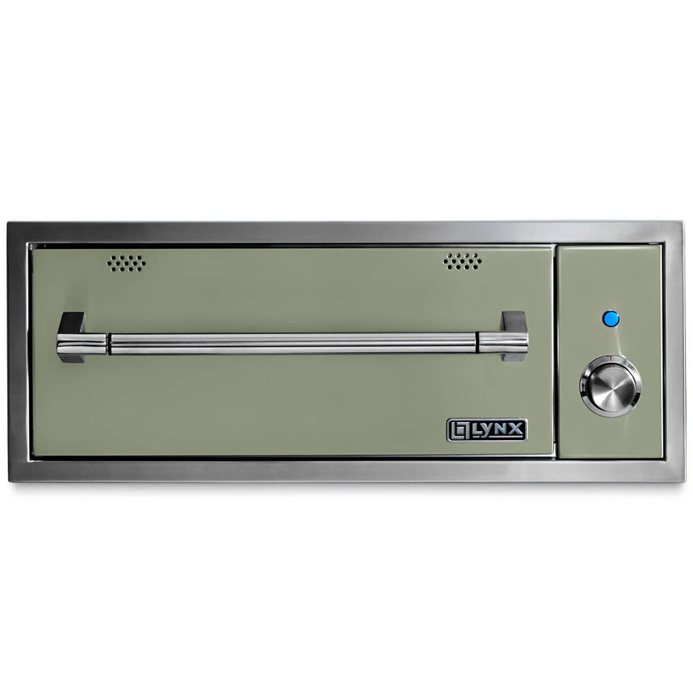 Built-in warming drawer with light green interior panel, vent holes, and temperature control