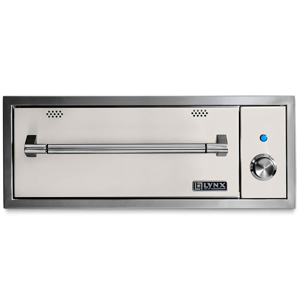 Built-in warming drawer with white interior panel, vent openings, and round temperature dial