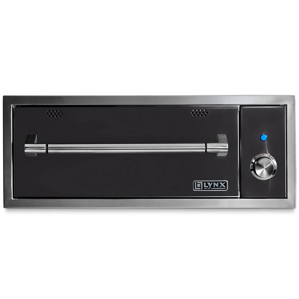 Built-in warming drawer with dark interior panel, vented holes, and temperature dial