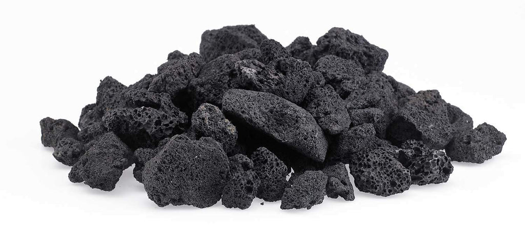 Lava rock chunks in dark black, medium size heap.