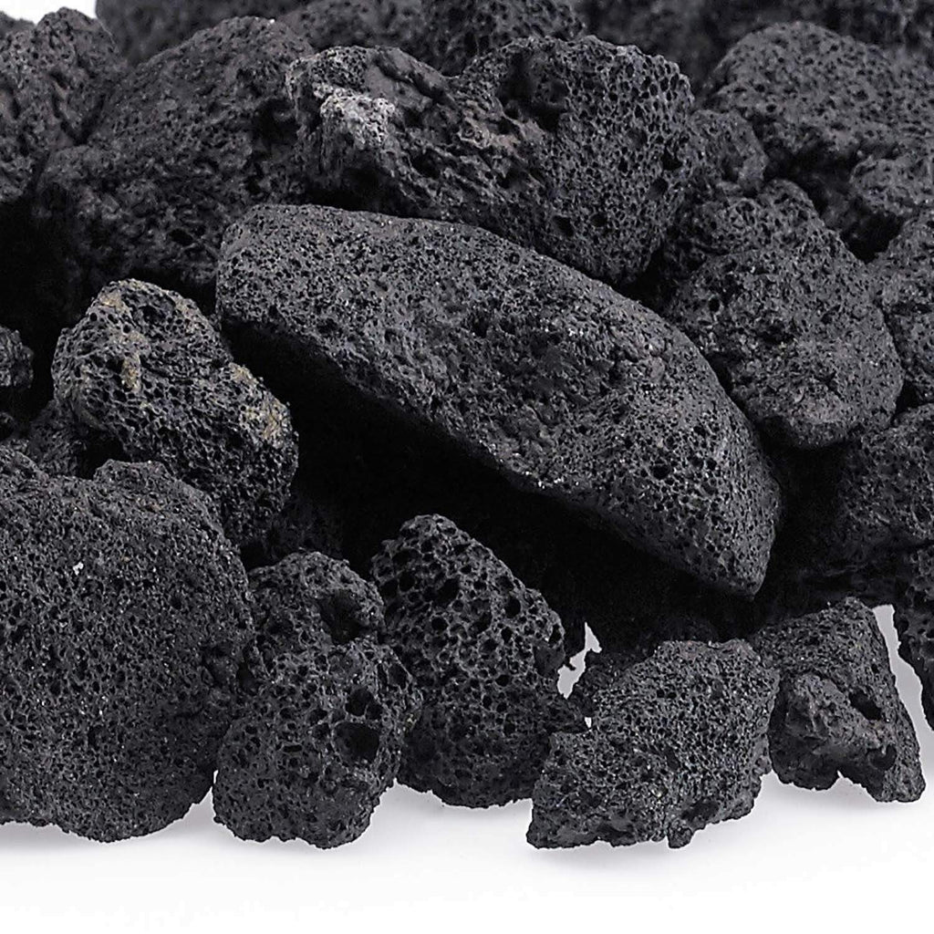 Dark black lava rock pieces with porous, pitted texture close-up.