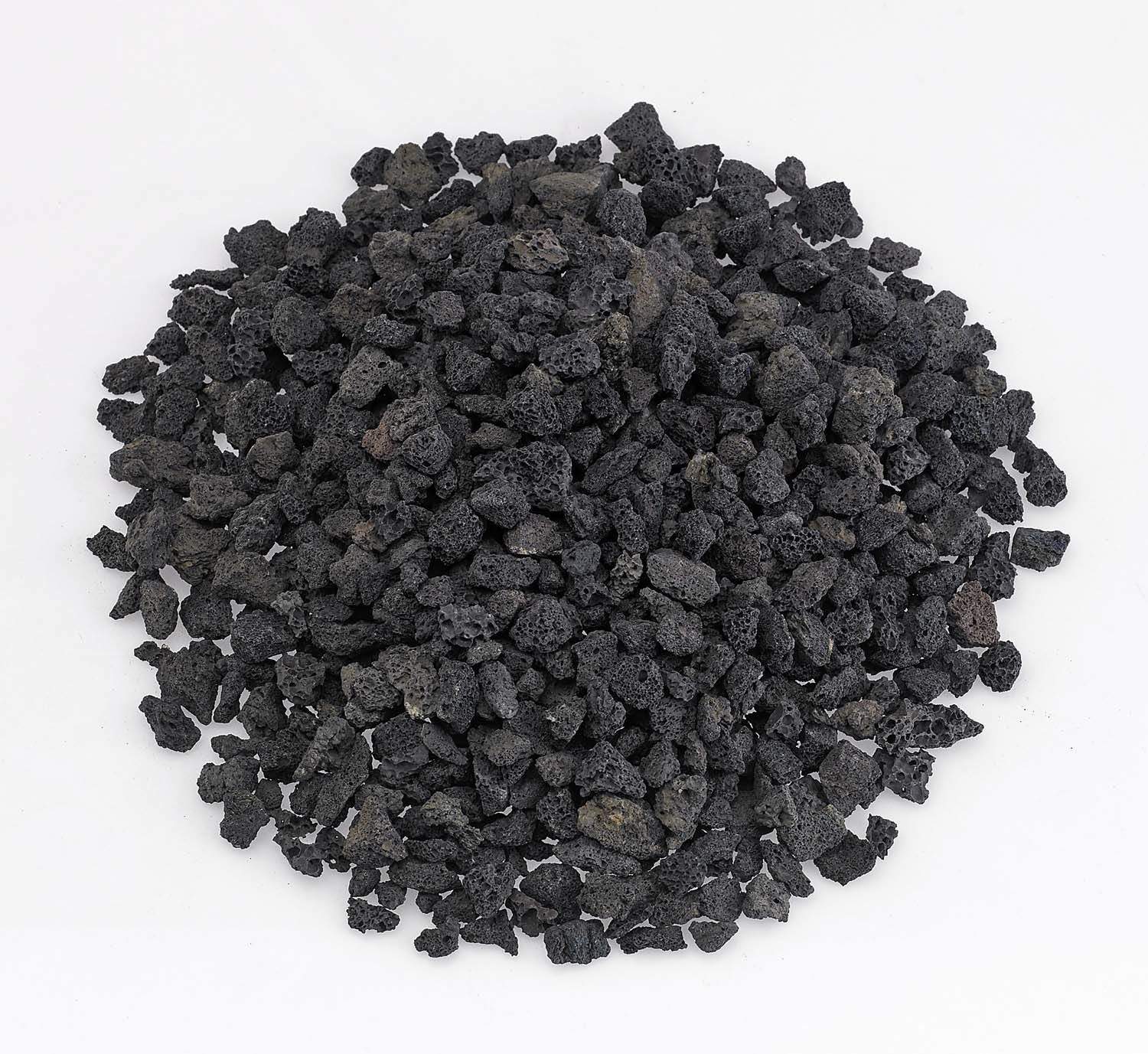 Small black lava rock, rough porous stones in a pile