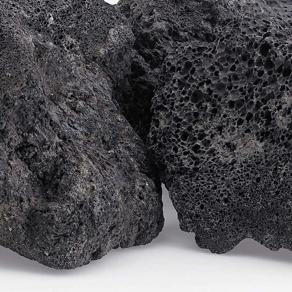 Close-up of black lava rock with porous, crater-like surface texture