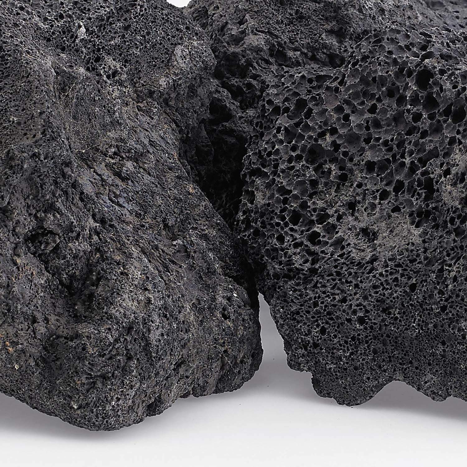 Close-up of black lava rock with porous, crater-like surface texture