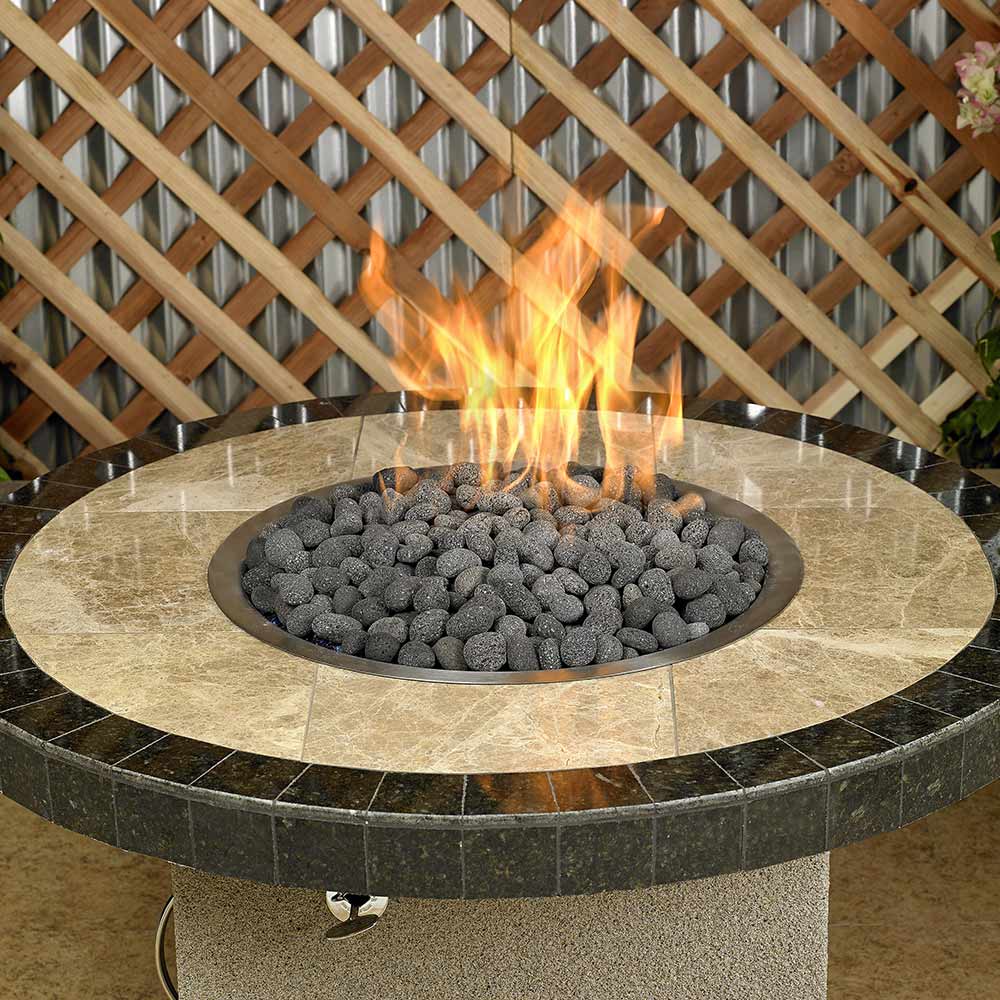 Gray lava stones in a round fire pit bowl with flames