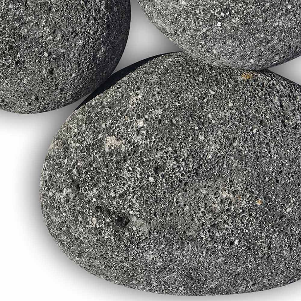 Close-up of gray speckled lava stones with rough, porous texture