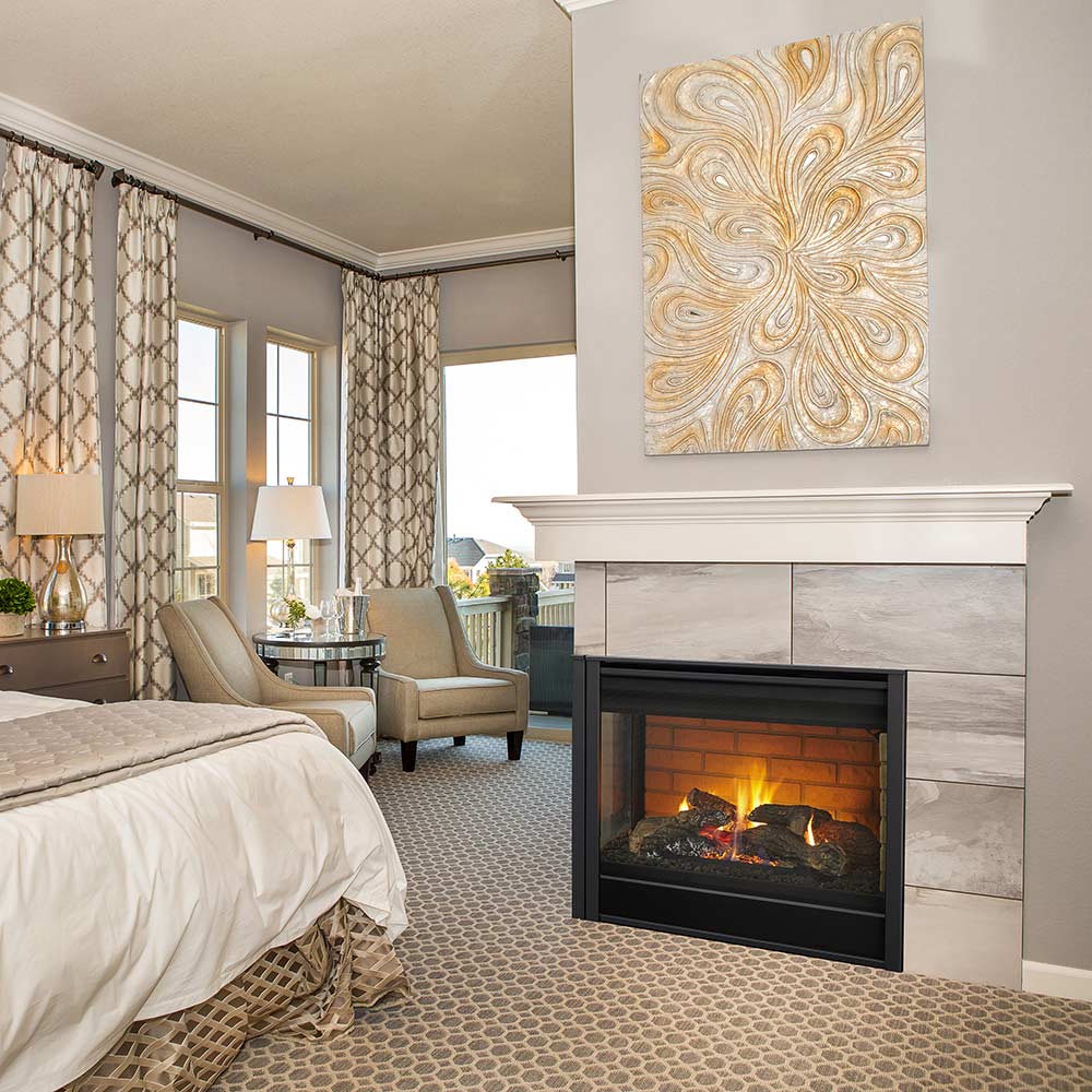 Indoor corner gas fireplace with black glass front and brick firebox, flames visible