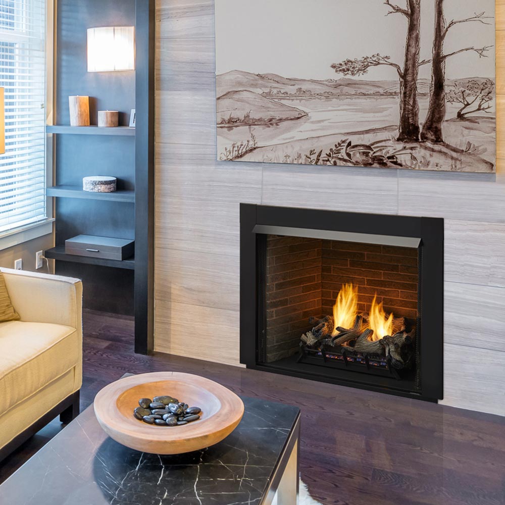 Vent-free gas fireplace insert in stone surround with burning gas logs