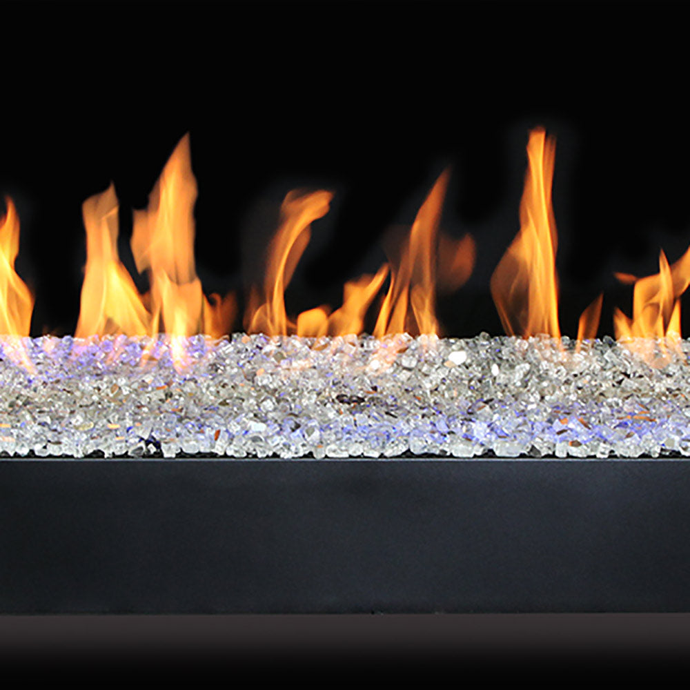 Linear gas burner with flames and clear glass media in a black tray