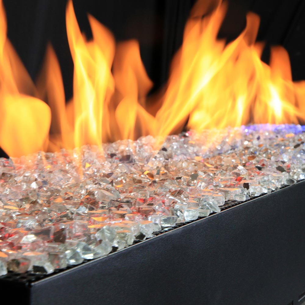 Flames over clear crushed glass in a black linear burner tray