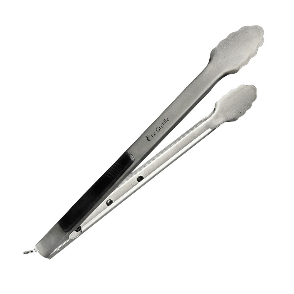Large stainless steel tongs with black non-slip grip and scalloped ends