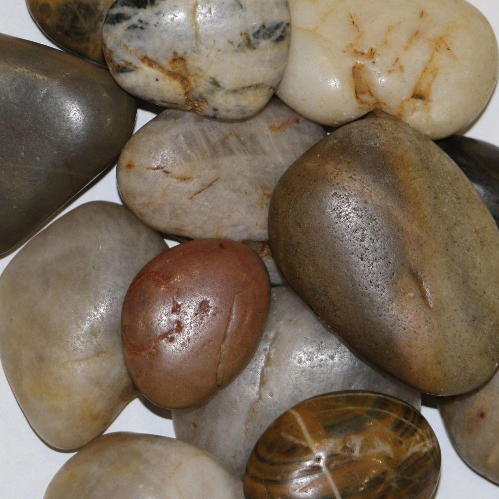 River rock accessory kit with assorted smooth stones in brown, gray, and cream