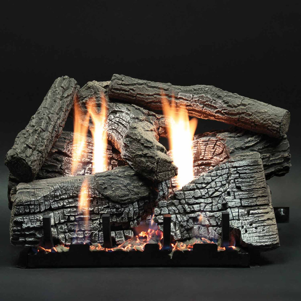 Stacked refractory log set with burning flames and dark charred log pieces