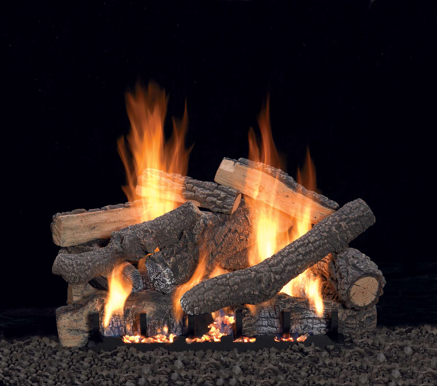 Refractory gas logs set with wood-look logs and visible flames