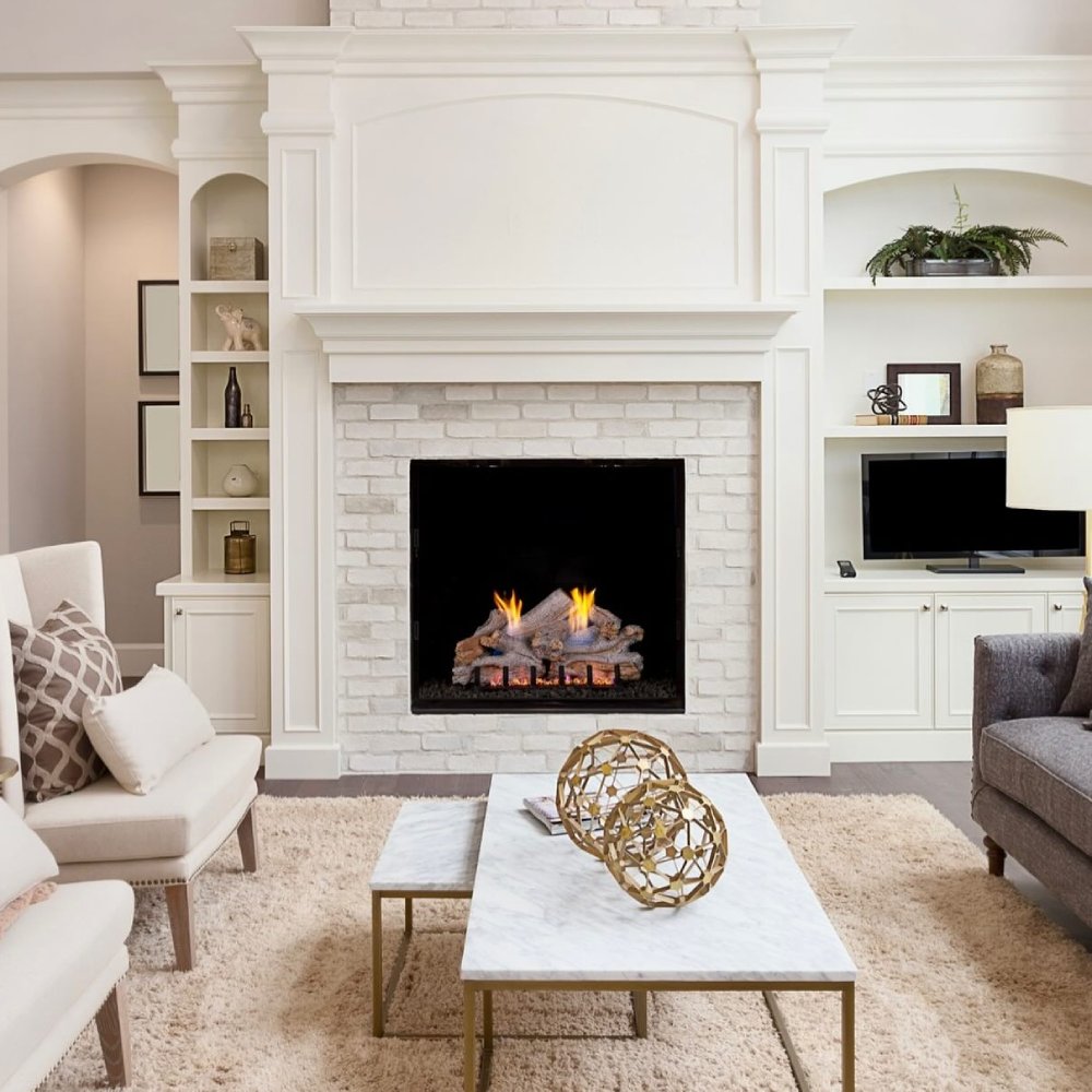 Ventless gas log set installed in a white fireplace with burning gray logs