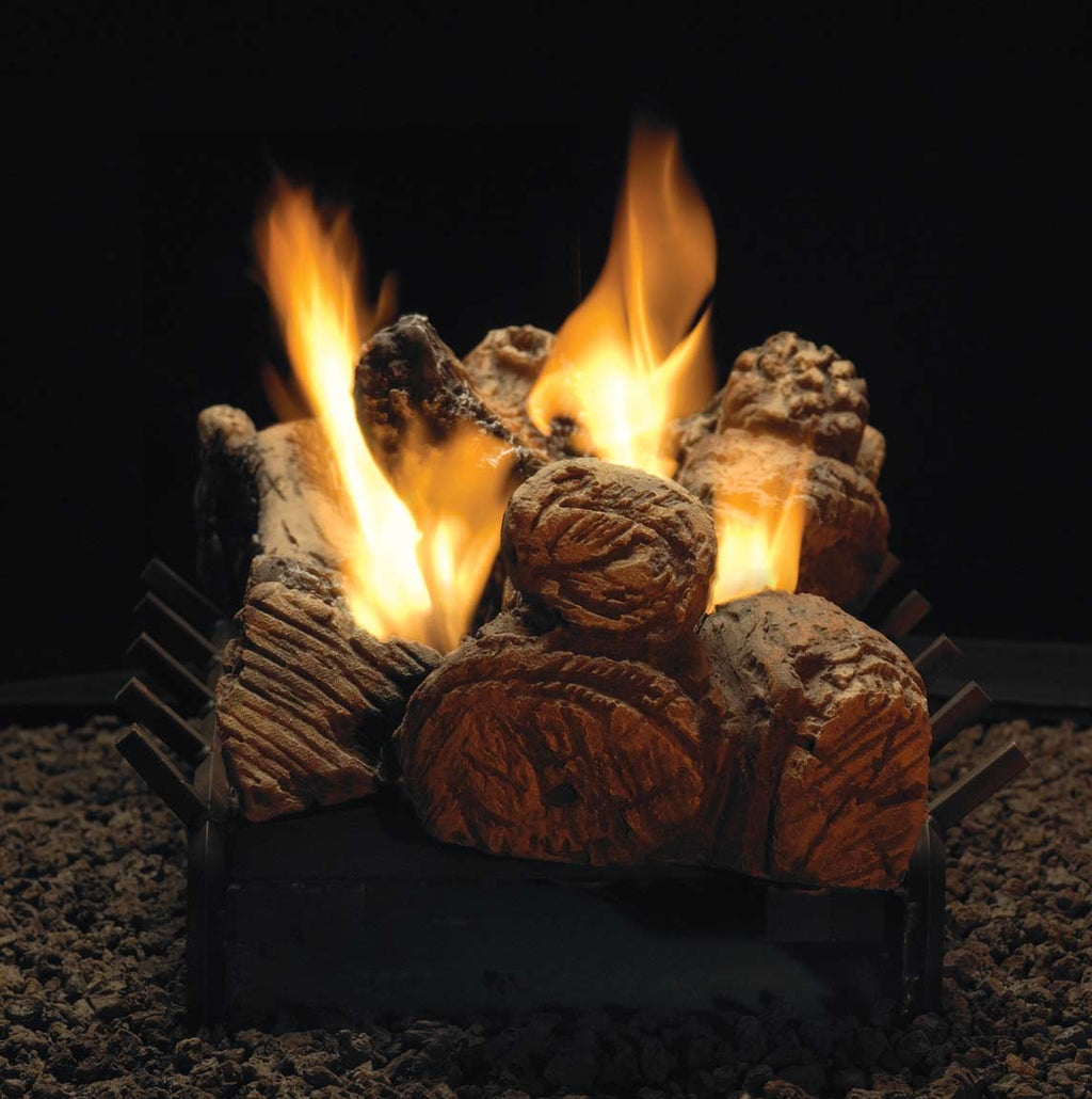 Gas log set with glowing faux logs and tall flames, stacked in black burner