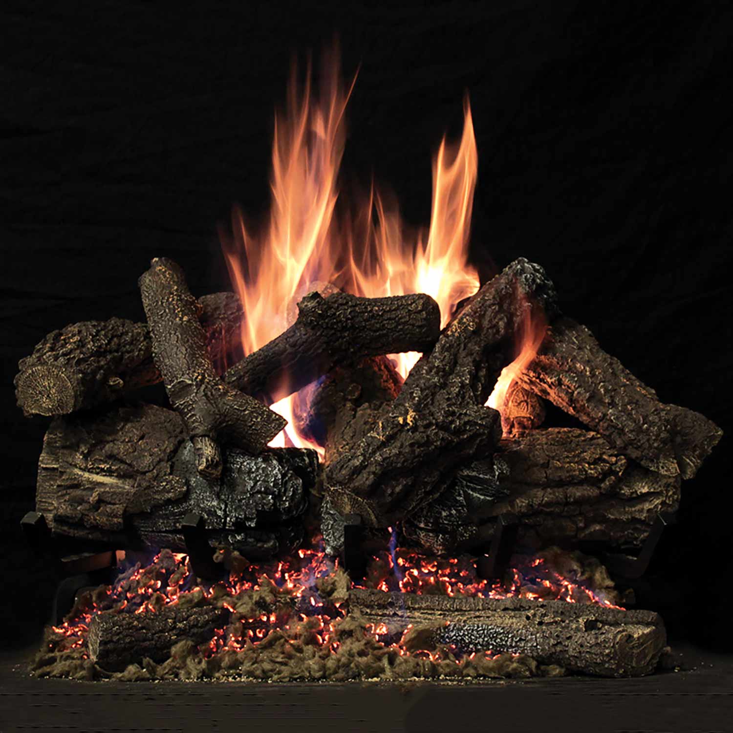 Natural gas fireplace log set with dark refractory logs and realistic flames